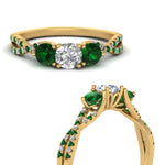 Load image into Gallery viewer, trellis-twisted-3-stone-round-cut-diamond-ring-with-emerald-in-yellow-gold-FD123699RORGEMGRANGLE3-NL-YG_4ccd01fd-96dc-4626-b408-e0252646b9a4?v=1756181932
