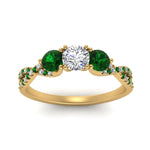 Load image into Gallery viewer, trellis-twisted-3-stone-round-cut-diamond-ring-with-emerald-in-yellow-gold-FD123699RORGEMGRANGLE5-NL-YG_27526fba-eb7e-455b-803f-27657cb7be92?v=1756181932
