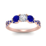 Load image into Gallery viewer, trellis-twisted-3-stone-round-cut-diamond-ring-with-sapphire-in-rose-gold-FD123699RORGSABLANGLE5-NL-RG_34968218-f9a3-4b28-abb1-ae632500e0e0?v=1756181932

