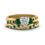 Load image into Gallery viewer, twisted-heart-diamond-wedding-band-with-emerald-in-yellow-gold-FDENS3301HTGEMGR-NL-YG.jpg

