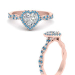 Load image into Gallery viewer, twisted-heart-shaped-blue-topaz-halo-engagement-ring-in-rose-gold-FD9126HTRGICBLTOANGLE3-NL-RG_684313d3-f2e7-46cf-88d3-dd63f6fe8326?v=1757924912
