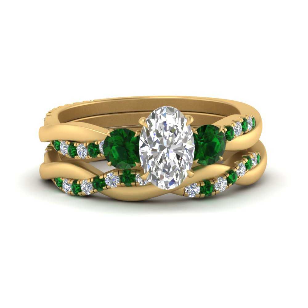 twisted-oval-shaped-diamond-wedding-band-with-emerald-in-yellow-gold-FDENS3301OVGEMGR-NL-YG.jpg