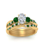 Load image into Gallery viewer, twisted-oval-shaped-diamond-wedding-band-with-emerald-in-yellow-gold-FDENS3301OVGEMGR-NL-YG.jpg
