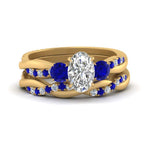 Load image into Gallery viewer, twisted-oval-shaped-diamond-wedding-band-with-sapphire-in-yellow-gold-FDENS3301OVGSABL-NL-YG.jpg
