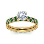 Load image into Gallery viewer, underhalo-eternity-cushion-cut-diamond-wedding-band-set-with-emerald-in-FD9168CUGEMGRANGLE3-NL-YG
