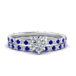Load image into Gallery viewer, underhalo-eternity-heart-shaped-diamond-wedding-band-set-with-sapphire-in-FD9168HTGSABLANGLE3-NL-WG
