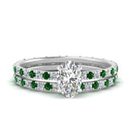 Load image into Gallery viewer, underhalo-eternity-oval-shaped-diamond-wedding-band-set-with-emerald-in-FD9168OVGEMGRANGLE3-NL-WG
