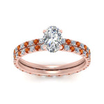 Load image into Gallery viewer, underhalo-eternity-oval-shaped-diamond-wedding-band-set-with-orange-sapphire-in-FD9168OVGSAORANGLE3-NL-RG
