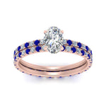Load image into Gallery viewer, underhalo-eternity-oval-shaped-diamond-wedding-band-set-with-sapphire-in-FD9168OVGSABLANGLE3-NL-RG
