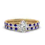 Load image into Gallery viewer, underhalo-eternity-oval-shaped-diamond-wedding-band-set-with-sapphire-in-FD9168OVGSABLANGLE3-NL-YG
