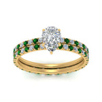 Load image into Gallery viewer, underhalo-eternity-pear-shaped-diamond-wedding-band-set-with-emerald-in-FD9168PEGEMGRANGLE3-NL-YG
