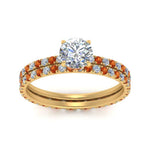 Load image into Gallery viewer, underhalo-eternity-round-cut-diamond-wedding-band-set-with-orange-sapphire-in-FD9168ROGSAORANGLE3-NL-YG
