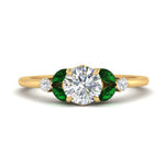 Load image into Gallery viewer, vintage-marquise-and-round-engagement-round-ring-with-emerald-in-yellow-gold-FDENR635RORGEMGR-NL-YG_fc220d40-f561-4175-98f4-384359a79f51.jpg?v=1765948149