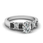 Load image into Gallery viewer, white-gold-oval-white-diamond-engagement-wedding-ring-with-black-diamond-in-prong-set-FDENS1027OVRGBLACK-NL-WG_e5a7ca4e-02fb-479c-b000-ea94de365043
