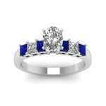 Load image into Gallery viewer, white-gold-oval-white-diamond-engagement-wedding-ring-with-blue-sapphire-in-prong-set-FDENS1027OVRGSABLANGLE5-NL-WG_382dca1b-a619-4823-b16e-fae14f4b6e85
