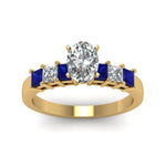 Load image into Gallery viewer, yellow-gold-oval-white-diamond-engagement-wedding-ring-with-blue-sapphire-in-prong-set-FDENS1027OVRGSABLANGLE5-NL-YG_b582f0a7-cfb2-49c5-bccb-d633377bd33b
